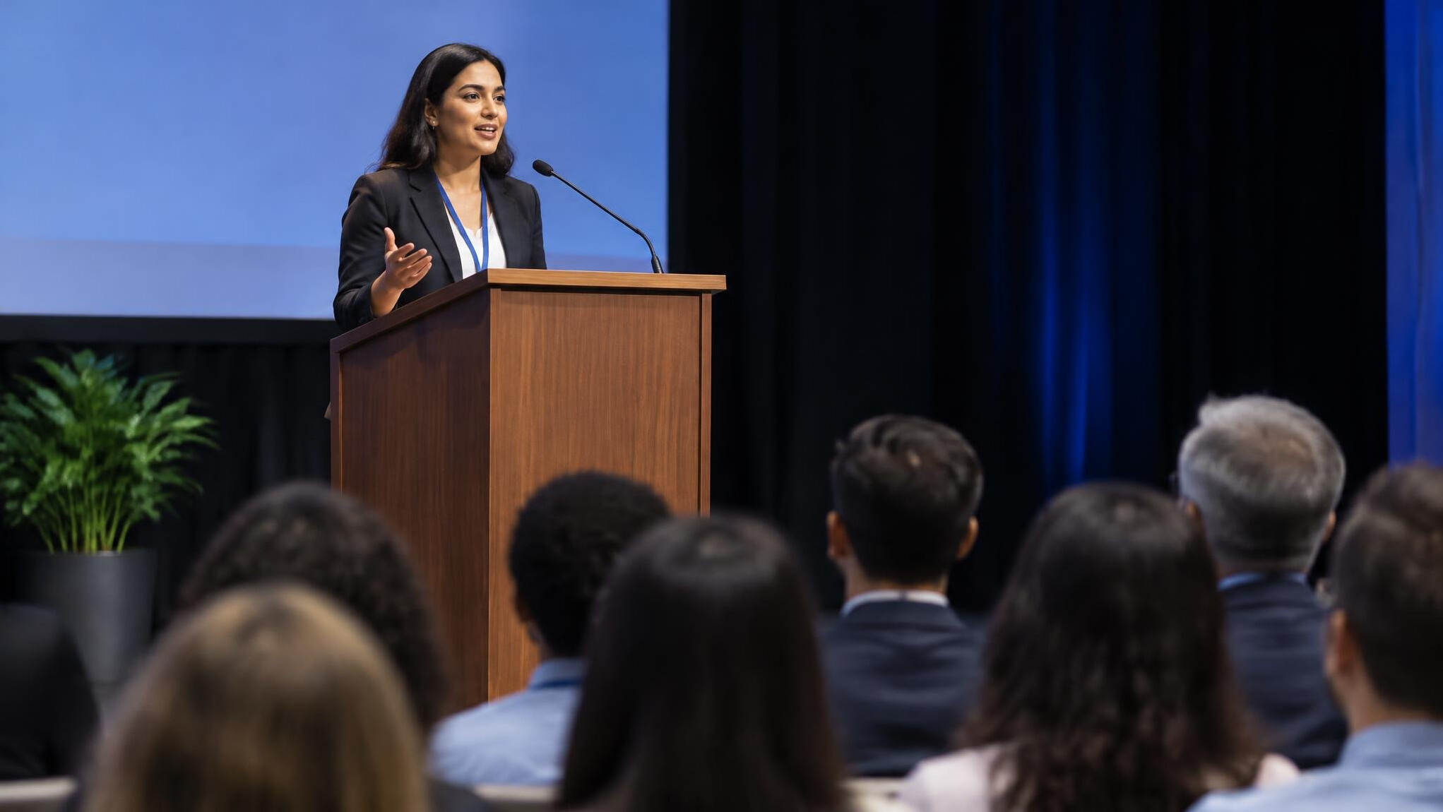person giving speech on stage